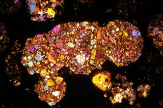 Illustration for article titled The Insides of Meteorites Are Nature's Stained Glass